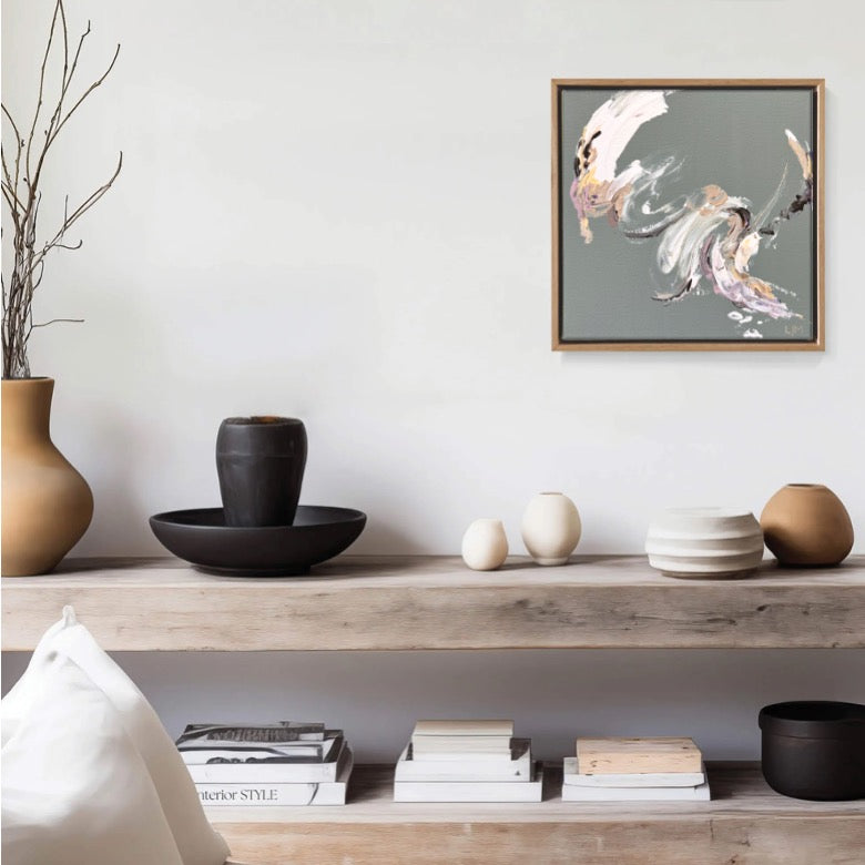 A small grey original abstract art by Lee J Morgan displayed on a living room wall